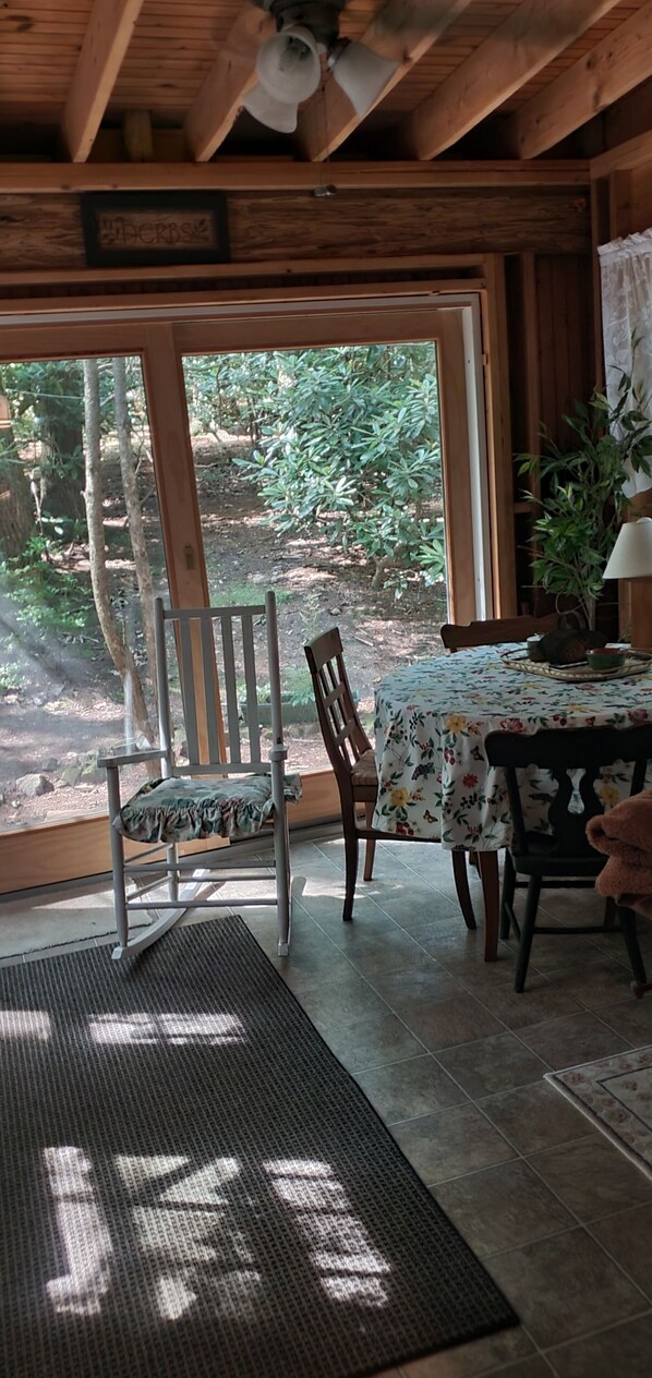 Additional dining in sunroom! Easy access to BBQ grill from sliding glass doors.