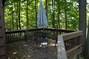 Enjoy a view of the lake and the  woods from the deck. 
