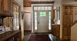 Majestic, grand, and welcoming front entrance with steps to the driveway.