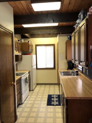 Kitchen with dishwasher range and microwave