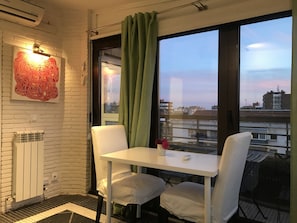 living-dining room with sunset view