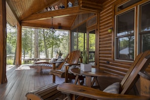 Enjoy a morning coffee on the covered veranda overlooking the lake.