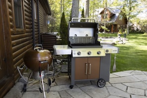 Weber 3 burner bbq off kitchen entrance overlooking lake.