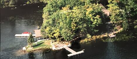 Aerial View of Cottage, Boathouse, and 3 Docks. 3+acres of PRIVATE lakefront.