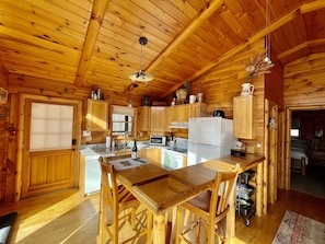 Kitchen area with built in wood bar 