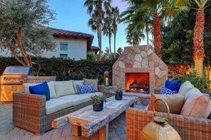 Cozy fireplace with golf course and unobstructed mountain views.