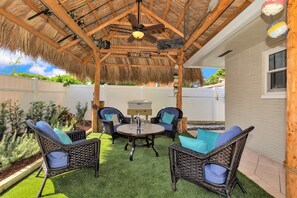 Large Tropical Tiki w/ Plush Furniture, Comfy Turf and Fan at the end of Pool