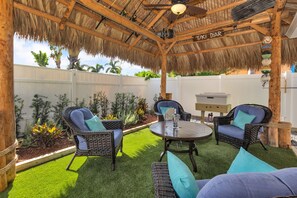 Large Tropical Tiki w/ Plush Furniture, Comfy Turf and Fan at the end of Pool