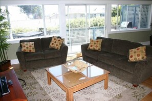 Great Room looking at the outside deck with BBQ.