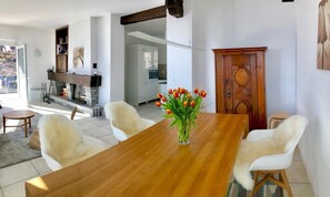 Living room with dining area and open kitchen. Newly built and designed in March 2021.