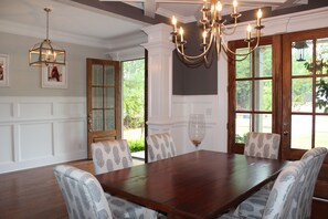 Front entry hall with dining room. Double French doors open to the front.