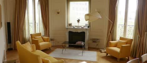 Dining room is bathed in light by 2 full height windows