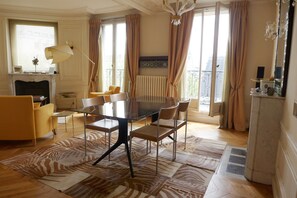 Dining area by the window offers a large table that can seat easily 4 guests