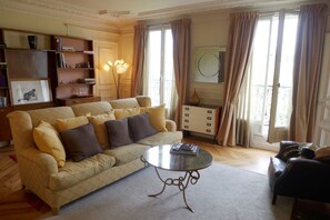 Living room where TV is located offers a very comfortable sofa