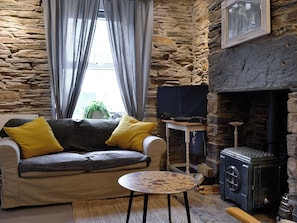 Open plan living space with wood burner | T&#375; ar y Tro, Ffestiniog, near Blaenau Ffestiniog