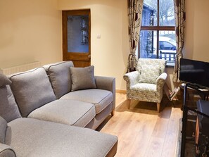 Comfortable furniture in the living room | Ramshead Cottage, Tebay, near Kendal