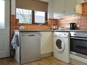 Well-equipped fitted kitchen | Coiltie Cottage, Drumnadrochit, near Inverness