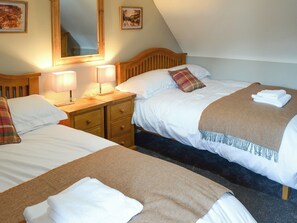 Delightful bedroom with twin double beds | Wallace House, Dornoch, near Tain