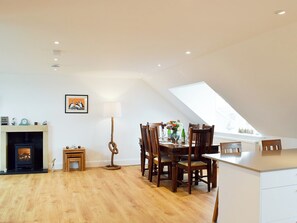 Dining area beneath a Velux roof light | Arc House, Cellardyke, near Anstruther
