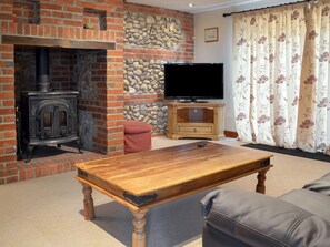 Delightful living room with wood burner | Church Farm Barn - Moor Farm Stable Cottages, Foxley, near Fakenham