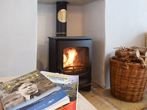 Relax in front of the cosy woodburning stove | Seadrift, New Quay