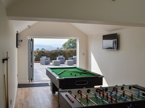 Games room opening onto the terrace | Estuary View, Exmouth
