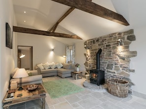 Cosy living room with wood burner | The Old Rectory Cottage, Tothill, near Louth