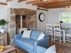 Delightful living area with feature fireplace | Bryn Awel, Moelfre, near Benllech