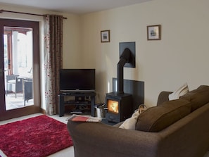 Comfortable living/ dining room with cosy wood burner | Bluebell Barn, Newbiggin on Lune, near Kirkby Stephen