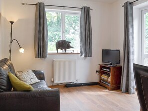 Welcoming living area within the open-plan living space | The Pigsty, Llanddeusant, near Holyhead