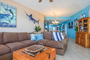 Sectional sleeper sofa and soothing decor in the living room.