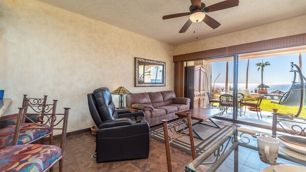 Living room with recliner and sofa.
