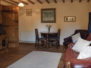 Living room with dining area | The Cider Press - Lawn Farm Retreats, Welland, near Malvern