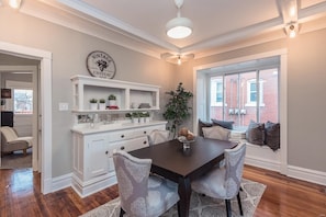 Dining room with built-in buffet and window seat