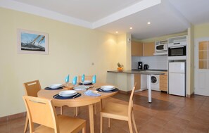 Prepare meals in the kitchenette and enjoy them at the dining table.