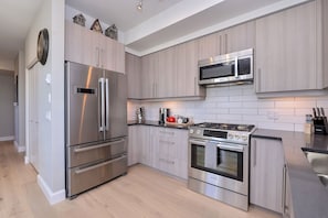 Prepare gourmet meals in your brand new kitchen, small appliances included!