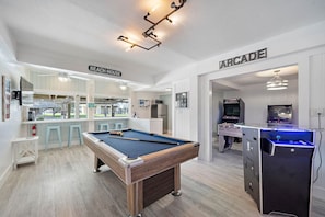 Enjoy this game room with a variety of games