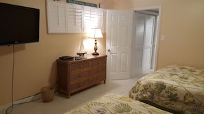 Guest bedroom with two queen beds and it is a walk through bedroom to Master.