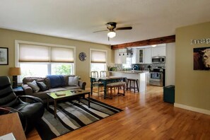 The Open Concept kitchen and living room makes this a rustic and spacious room.