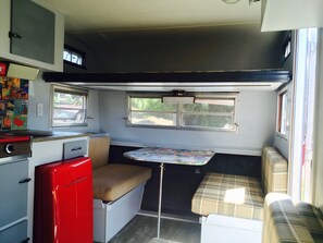 Table and booths turn into a extra large twin bed. There is also an extra large