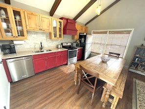 Updated Kitchen with farm table that sits 8