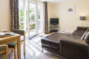 The lounge looks straight out onto the garden & BBQ area.