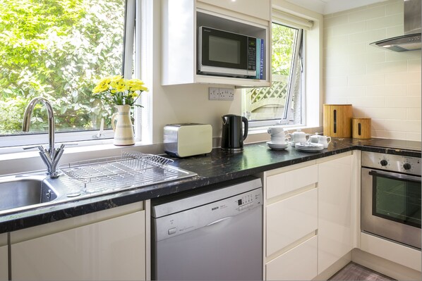 Modern fully equipped kitchen, ideal for when you aren't BBQ'ing.