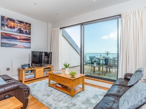 Living area with sliding doors to the balcony | Sand Dunes - Nassau Court, Westward Ho!