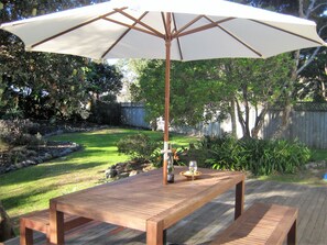 Relax on the deck in the private, secluded garden.