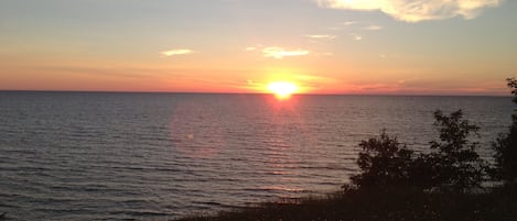 Enjoy picture-perfect views every night from our lakefront cottage!