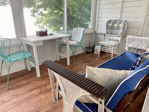 Screened in porch with windows that close overlooking lake
