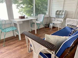 Screened in porch with windows that close overlooking lake