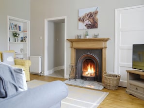 Welcoming living room with an open-fire | The Old School House Cottage, Kettins, near Blairgowrie