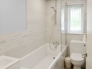 Family bathroom with shower over bath | Bluebell - Kilbol Country Cottages, Polmassick, near St Austell